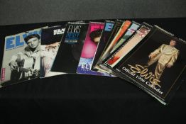 A collection of vintage Elvis calendars. H.42 W.30cm. (each)