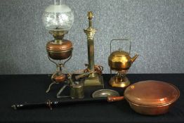 A group of antique copper and brass, including a bed warmer, and oil lamp with etched glass shade, a