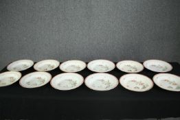 A set of ten 19th century hand decorated Coalport dinner plates with retail marks for Soane and