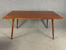 A contemporary retro styled teak dining table. H.77cm x W.160cm x D.80cm.