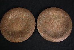 A pair of vintage copper plates with raised foliate detail. Dia.22cm. (each).