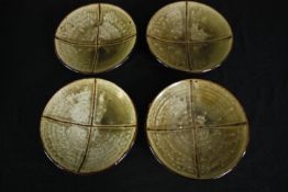 A set of four glazed shallow bowls. Dia.22cm. (each).