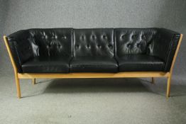 A mid century beech framed sofa with leather upholstery, model J148 by Erik Jorgensen. H.80 W.204