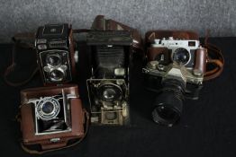 Five vintage cameras, various makers and a 16mm movie camera. H.16cm. (largest).