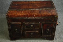 A late 19th century Continental studded leather trunk with hinged lid fitted with drawers and