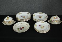 A collection of 19th century hand decorated plates and lidded tureens. Dia.27cm. (largest).