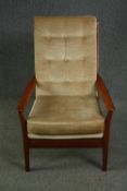 A pair of mid century teak framed Cintique lounge armchairs in original buttoned velour