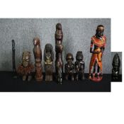 A collection of carved and painted African figures along with a stone bust. H.48cm. (largest).
