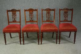 Dining chairs, a set of four Victorian carved walnut. H.87cm. (each).