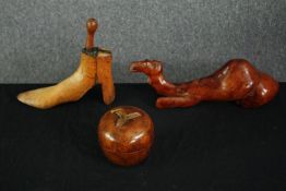 A late C19th hinged boot last, a carved lidded apple bowl and a carved camel. H.13 W.40 D.10cm.