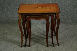 A set of early 20th century French Louis XV style Kingwood, tulipwood and inlaid nest of tables. H.