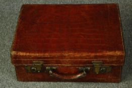 A vintage crocodile skin vanity case. H.19 W.48 D.36cm.