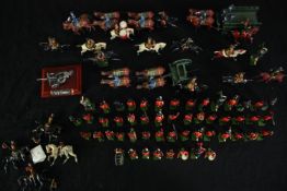 A large collection of vintage lead soldiers and other military figures, Scottish regiment, some with