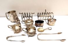 A collection of 19th and 20th century silver, including a pair of mustard pots with blue liners, two