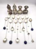 A collection of silver, including two pairs salt and pepper shakers, a set of nine coffee spoons