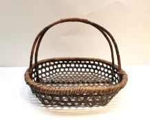 A Meji period Japanese Ikebana bamboo handwoven basket of oval form. H.30 basket 34 x 39cm