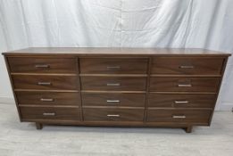 Sideboard, contemporary teak with a bank of twelve drawers. H.77 W.183 D.32cm.