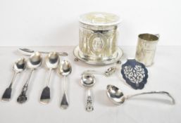 A silver plated ice bucket along with other miscellaneous silver plated items.