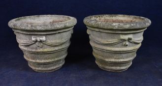 A pair of composite stone garden planters. H.41 W.51cm