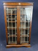 Bookcase, mid century oak with leaded glass doors. H.135 W.80 D.29cm