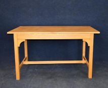 A light oak centre or side table. H.76 W.137 D.68.5cm.