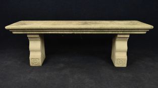 A three part composite stone garden bench. H.45 W.137 D.42cm
