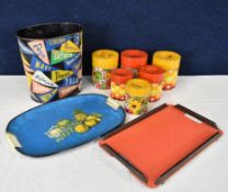 A collection of mid century items, American university waste bin, storage cannisters and two trays.