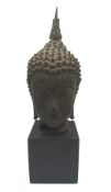 A 19th century Burmese bronze buddha head on plinth base. H.23cm.