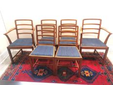 A set of six mid century teak dining chairs by Heals (with maker's disc), including two carvers.