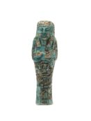An Egyptian blue faience shabti. H.13cm.