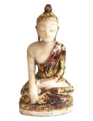 A carved white marble seated Buddha with gilded detail. H.35 D.19 W.8cm