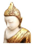 A large Burmese white marble seated Buddha with gilded detail. H.56 L.39 W.24cm