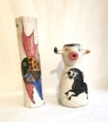 Two mid century vases, one with a fish design the other depicting a bull. Tallest 34.5cm.