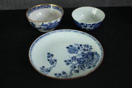 Two hand painted Chinese porcelain blue and white bowls and a similar plate, 19th century. One