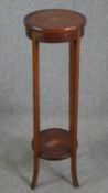 An Edwardian mahogany and satinwood inlaid torchière or jardinière stand. H.95 Dia.29cm.