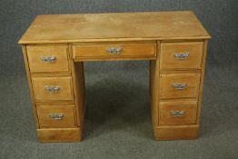 A Victorian style pedestal desk with maker's label. H.76 W.111 D.50cm.