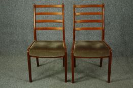 A pair of mid century teak G-Plan dining chairs. H.89cm.