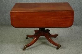 A Regency style mahogany breakfast table with drop leaf sides, mid 19th century. H.72 W.110 D.100cm.