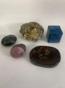 A cut and chamfered lapis lazuli specimen, a piece of Jasper, an amethyst egg and a labradorite