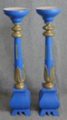A pair of painted ecclesiastic style floor standing candlestands. H.126cm. (each).