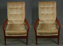 A pair of mid century teak framed Cintique lounge armchairs in original buttoned velour