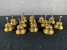 A collection of thirteen brass hand bells. H.8cm Dia.6cm. (each)