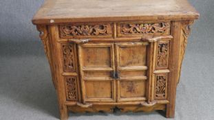 A carved Eastern hardwood sideboard H.87 W.107 D.60cm.