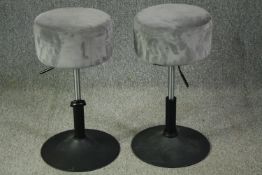 A pair of contemporary counter stools with swivel rise and fall action. H.68cm. (each).