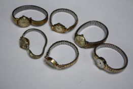 Six vintage ladies watches with expanding bracelets. Face. Dia. 2cm. (largest).