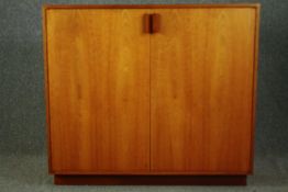 A mid century style teak side cabinet. H.104 W.117 D.53cm.