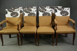 A set of eight dining chairs to include two carver armchairs with slip on covers to their backs. H.