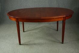 A 19th century style fruitwood extending dining table with two extra leaves by Grange Furniture. H.