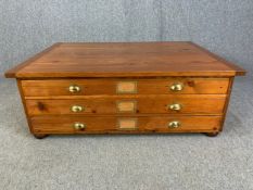 A pine coffee table from the top section of a plan chest. H.45 W.125 D.89cm.