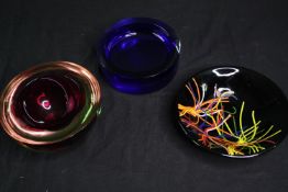 A collection of three art glass bowls. Dia.18cm. (largest).